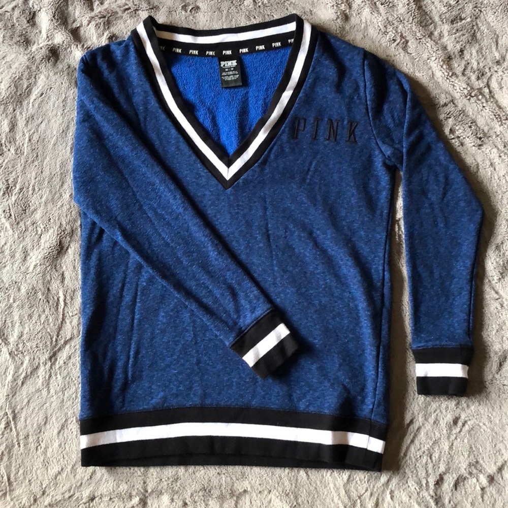 Blue varsity deep v neck sweater.